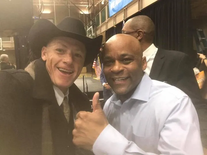 Former Denver Mayor Michael B. Hancock with ARCM Roofing’s Anthony Hong at a community meeting